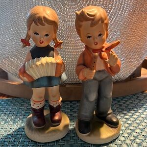 Vintage Hummel-like porcelain figures of boy and girl with musical instruments